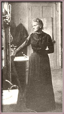 Curie standing in lab, 1913